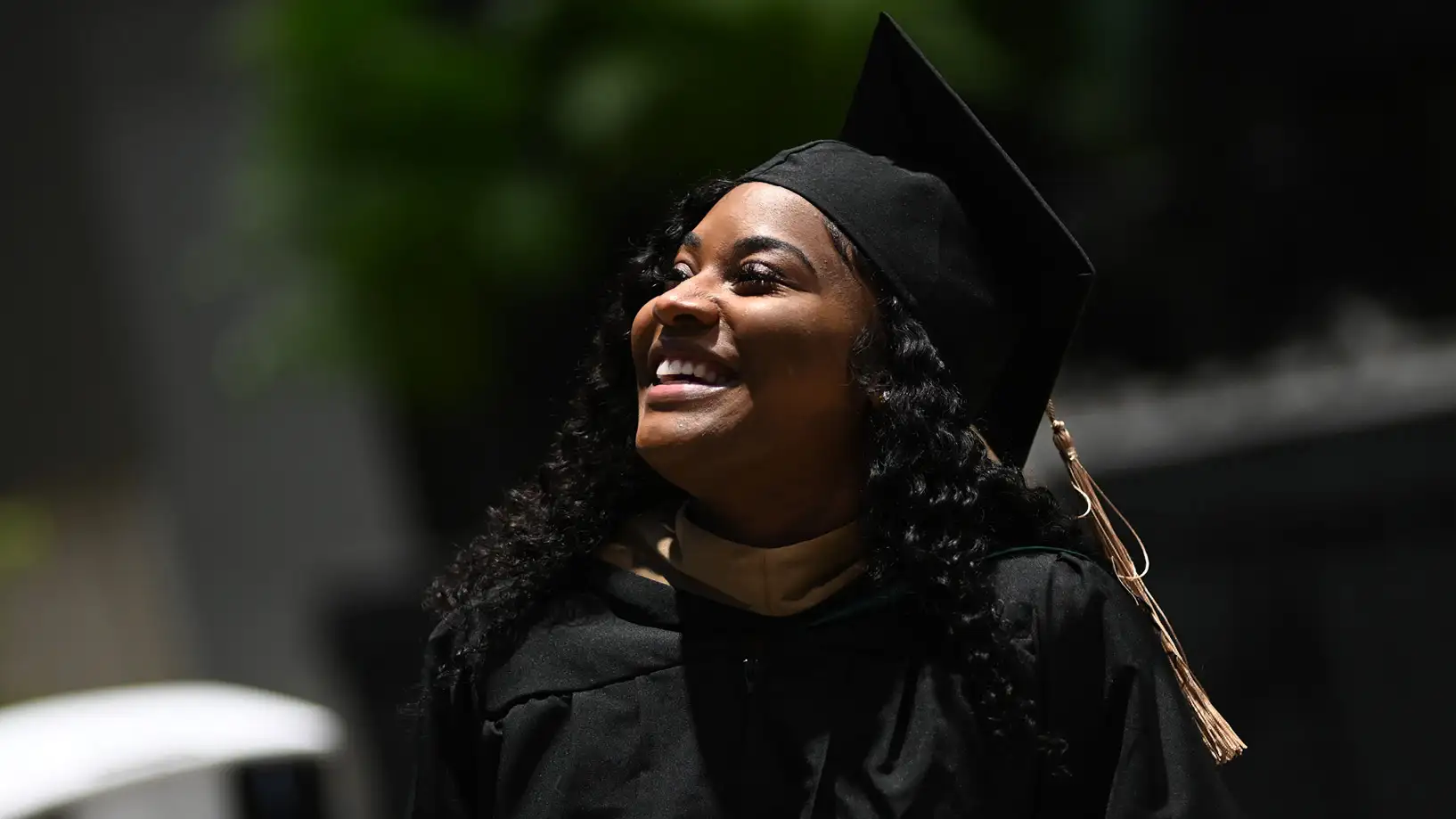 Smiling, happy, black female graduate